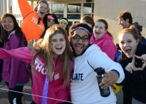 Gregory Lapocho and Jillian Cerinski got a break in the weather on an otherwise rainy Friday and enjoyed a sunny wait outside the Bryce Jordan Center as they waited in line to support this year's THON. 