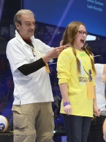 Grace Gasior, 10, a THON child's sibling from Pittsburgh, donates hair on stage during THON 2015 on Saturday.