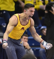University of Minnesota's Steve Jaciuk celebrates after competing at the 2015 Big Ten Gymnastics Championship held at Penn State March 28, 2015. Jaciuk competed on the Still Rings and earned a third place finish on the Parallel Bars at the event.
