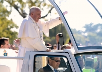 Pope Francis waves to the throngs of people gathered for a parade near the White House in Washington, D.C. Wednesday, September 23, 2015.